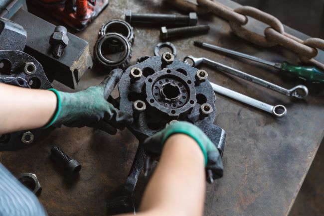 Man inspecting OEM electrical component to meet quality standards